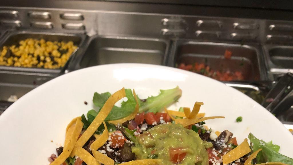The Organic Green Mix Bowl · Mix green lettuce, black beans, queso, pico De gallo, guacamole and tortilla strips, with your choice of one of the proteins below