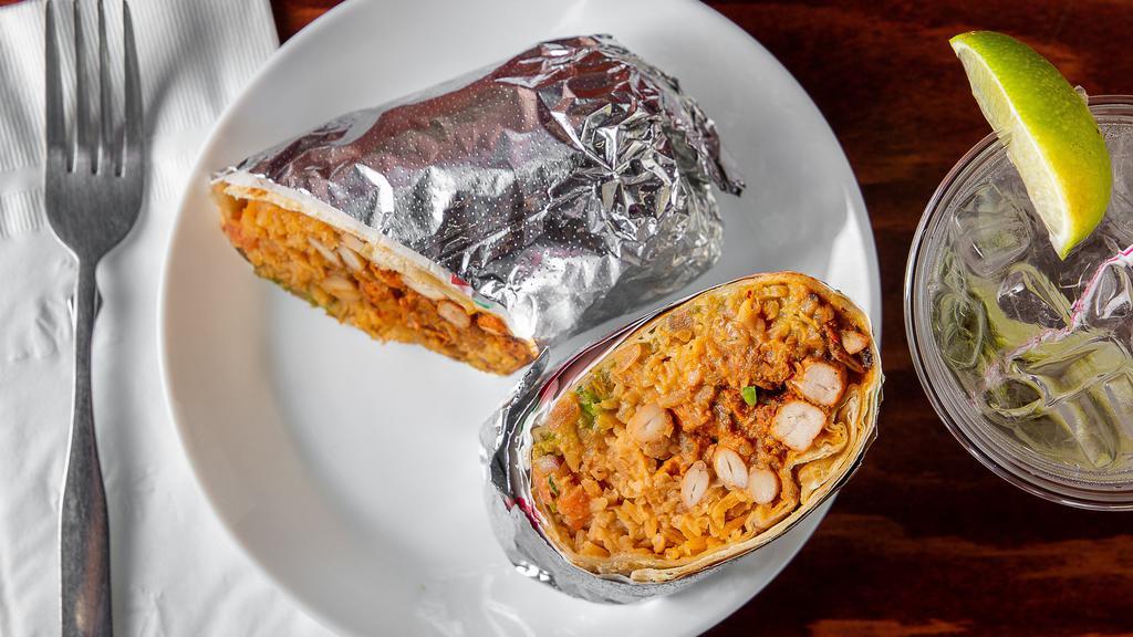 Al Pastor Burrito · Braised pork grilled on a flour tortilla, with Spanish rice, pinto beans, pico De gallo and guacamole.