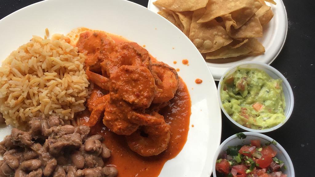 Shrimp Ala Diabla · Jumbo shrimp seared in garlic infused rice oil with our homemade Diablo sauce, served with Spanish rice, pinto beans, side of Pico De Gallo, guacamole and your choice of three flour or four corn tortillas
