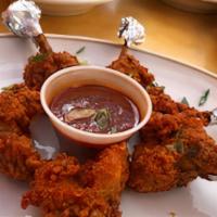 Chicken Lollipop · Chicken wings shaped as lollipop, seasoned in a mild red batter and crispy fried.