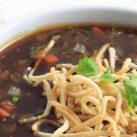 Manchow Soup (Chicken) · Indo Chinese favorite, chicken, sauteed ginger, garlic, and soy broth topped with crispy noo...