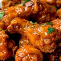 Buffalo Wings (8Pc) · Chicken wings marinated and tossed in hot-buffalo sauce.