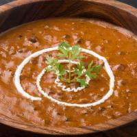 Dal Makhani · A classic flavorful and aromatic dish prepared with Black Lentils cooked in Desi Ghee,  Crea...