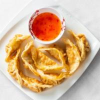 Fried Gyoza (8 Pcs) · Fried pot stickers with pork (or chicken) and vegetables. Served with soy sauce.