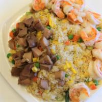 Combo  Fried Rice · Chicken, Pork, shrimp, egg, mixed beans, house soy sauce.