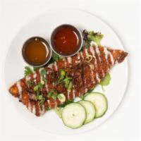 Crispy Trout · house lightly breaded trout fillet (6oz.) over fresh greens,
side pineapple chili sauce, and...