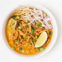 Khao Soi · crispy and steamed egg noodle, your choice of protein cooked in northern Thai ginger & turme...