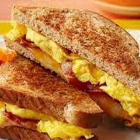 Bacon And Egg Sandwich · Served with lettuce, tomato on Texas Toast.