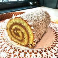 Coco Roll - Whole · Artisan sponge cake, dulce de leche, coconut.