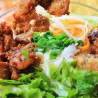 Grilled Chicken And Beef Noodle Salad · Vermicelli, 1 egg roll, grilled chicken, grilled beef, lettuce, cucumber, lettuce, carrot, r...