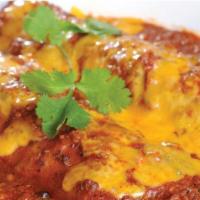 Las Ricas  · (2) Chicken ranchero enchiladas, topped with beef gravy, Monterey Jack cheese, and sour crea...