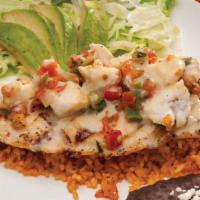 Fish Playa Azul · Grilled tilapia fish fillet served on a bed of rice and topped with crab meat, lemon butter ...