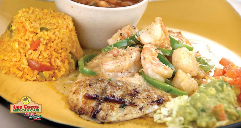 Fish Cancún · 10oz. Fresh fish fillet, sautéed in butter sauce, garlic and cilantro, topped with crab meat, shrimp, scallops and sliced bell peppers.