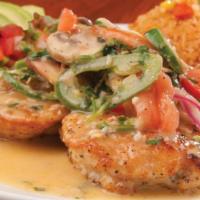 Pollo Ixtapa · Chicken breast sautéed in wine with onions, jalapeños, fresh garlic, tomatoes, cilantro, and...