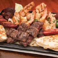 Parrilla San Luis · Beef and chicken fajitas, carnitas, jalapeño sausage, grilled shrimp, chicken quesadillas, a...