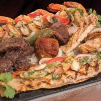 Delicioso · Fish fillet, grilled shrimp, beef and chicken fajitas, pork carnitas. Served with rice, bean...