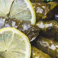 Grape Leaves (8 Piece) · Vegan stuffed grape leaves with onion, rice, dill, and mint.