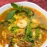 Thukpa · Tibetan style noodles simmered in a thick broth soup and veggies with onions, cilantro, and ...