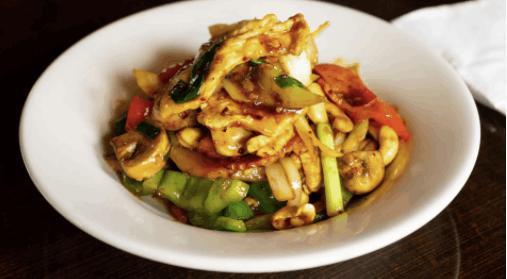 Cashew Stir Fry · Stir fried roasted chili paste with cashews, carrots, garlic, onions, mushrooms, and bell peppers.