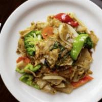 Pad Kee Mao · Stir fried flat rice noodles with broccoli, carrots, egg, bell peppers and sweet black soy s...