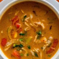 Chicken Tom Yum · A spicy and sour soup with mushrooms, white onion, lemongrass, cilantro, Kaffir lime leaf an...