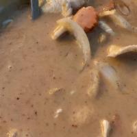Massaman Curry · With coconut milk, white onions, carrots, potatoes and peanuts.