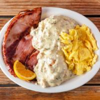 Ham Steak · Ham Steak with 2 eggs and either biscuits and gravy or hash browns and toast
