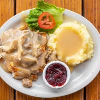 Hot Turkey Sandwich · Served on open faced texas toast with mashed potatoes and gravy and a side of cranberry sauce