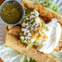 Smoked Chicken Flautas · Guacamole, sour cream, shredded lettuce & salsa verde