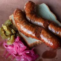House-Made Hot Link · Our Texas Style Hot links are made and smoked in-house.  (Price is per link)