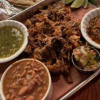 Pork Carnitas For Two · Applewood-smoked pulled pork shoulder, salsa verde, salsa roja, fire roasted mexican corn, f...