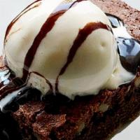 Warm Chocolate Brownies · served warm, topped with a scoop of vanilla ice cream and a drizzle of bourbon chocolate sauce