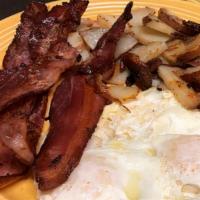 Classic 2 Egg Breakfast · Served with hash browns or Idaho home fries and choice of toast, biscuit, cinnamon roll, 1/4...