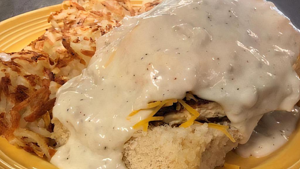 Chicken & A Biscuit · Maple glazed fried chicken atop a split buttermilk biscuit and topped with sharp Cheddar cheese, 2 eggs and smothered with our famous homemade sausage gravy. Served with hash browns or Idaho home fries.
