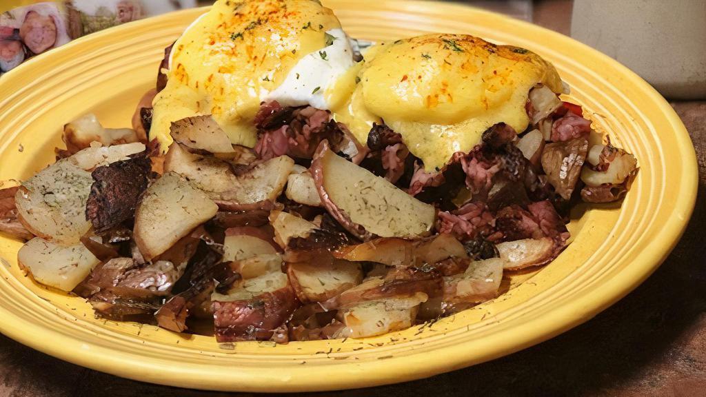 Irish Benedict · Slow roasted corned beef hash atop a golden corn muffin topped with two eggs and rich Hollandaise sauce.