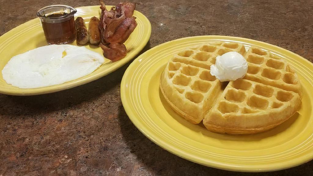 Waffle Combo · A traditional buttermilk waffle, 2 eggs, and choice of 4 bacon strips, 4 sausage links or 2 sausage patties.