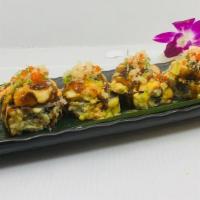 Volcano Roll · Lightly fried snow crab and avocado inside, topped with. baked scallop, eel sauce, spicy may...