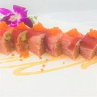 Pink Lady Roll · Shrimp Tempura, spicy tuna, avocado wrapped by soy . paper, topped with yellowtail, tuna, ee...