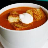Tomato Basil Soup · Our signature creamy tomato basil soup drizzled w/sour cream & topped w/our famous grilled c...