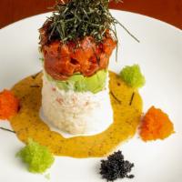 Tuna Tower · rice, crab salad, avocado, spicy tuna cubes, seaweed nori over wasabi aioli,  tobiko on the ...