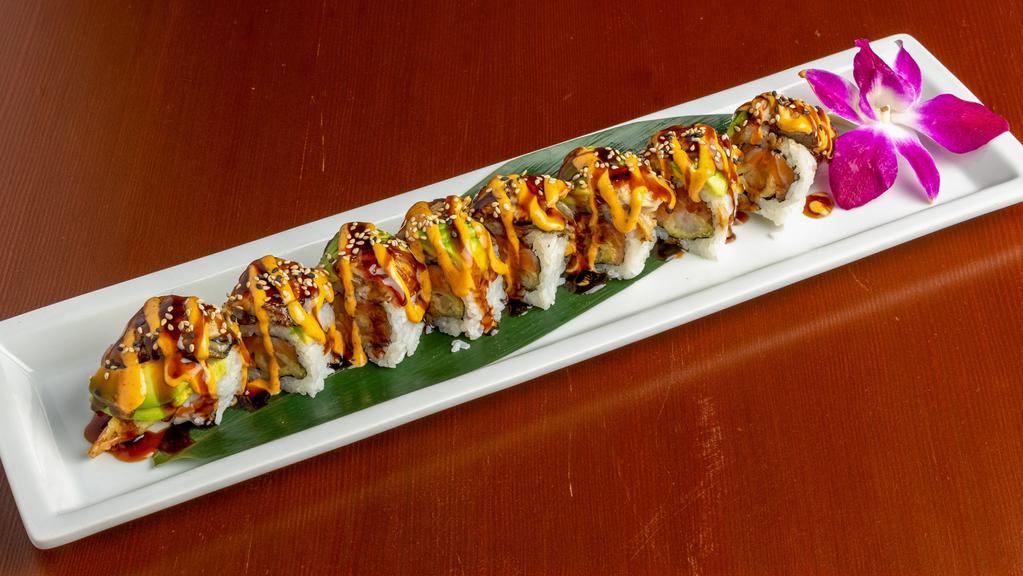 Dragon Roll · Shrimp tempura, salmon. Topped  with unagi, avocado drizzle with spicy mayo and sweet unagi sauce