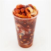  Cueritos Con Cacahuate · it is a cup with pork skin and japanese peanuts with chamoy tajin valentina and lemon