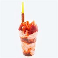 Fresada 16 Oz · it is a cup with strawberry ice cream with natural strawberries  with chamoy tajin tamarind ...