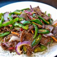 Mongolian Beef · Hot and spicy. Beef slices stir-fried with onions and scallions.