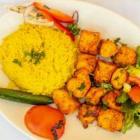 Chicken Tikka · Marinated chicken cubes in yogurt lemon juice and special spices charbroiled and served over...