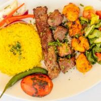 Moon Mix Grill · One chicken tikka, one beef kebab and one chicken kebab. Served over rice, salad and pickles.