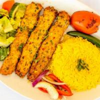 Chicken Kebab · 3 skewers seasoned ground chicken mixed with chopped parsley, onions charbroiled and served ...