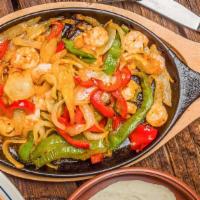 Fajitas (1 Choice Of Meat)  · Charbroiled strips of marinated beef, chicken, or shrimp with sautéed onions and bell pepper...