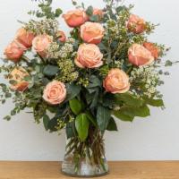 Roses Arranged · Premium long stem roses arranged artfully in a vase with fresh greens and filler.
