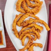 Onion Bhaji · Dairy free, gluten free. Sliced onion dipped in a seasoned chickpea-flour batter and deep fr...